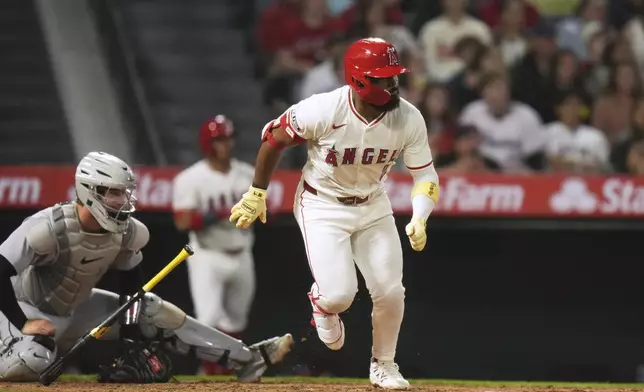 Los Angeles Angels' Luis Rengifo (2) watches after hitting a two-run single during the sixth inning of a baseball game against the Detroit Tigers Saturday, May 3, 2025, in Anaheim, Calif. (AP Photo/Jae C. Hong)