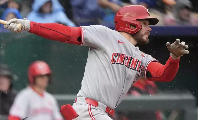 Cincinnati Reds' Gavin Lux watches his RBI single during the third inning of a baseball game against the Kansas City Royals, Monday, May 26, 2025, in Kansas City, Mo. (AP Photo/Charlie Riedel)