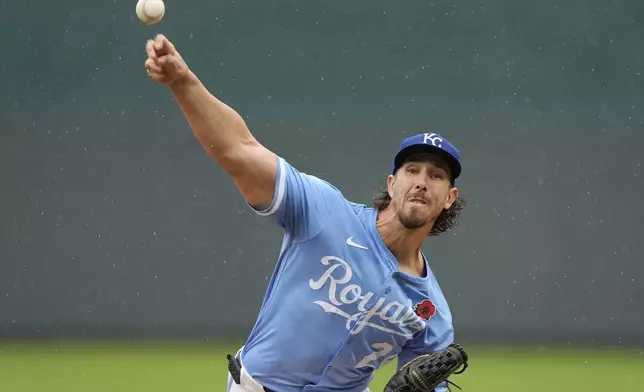 Kansas City Royals starting pitcher Michael Lorenzen throws during the first inning of a baseball game against the Cincinnati Reds, Monday, May 26, 2025, in Kansas City, Mo. (AP Photo/Charlie Riedel)