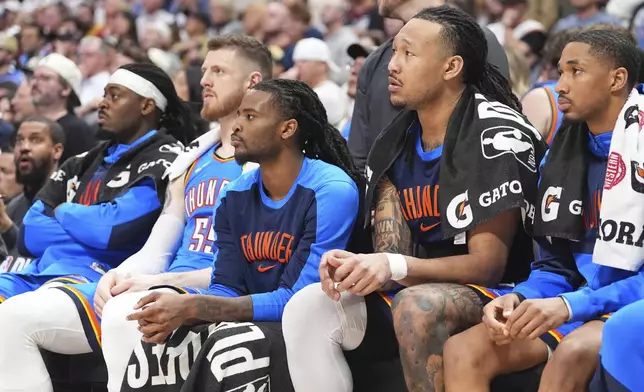 From left, Oklahoma City Thunder guard Luguentz Dort, center Isaiah Hartenstein, guard Cason Wallace, forward Jaylin Williams and guard Aaron Wiggins look on from the bench as time runs out in the second half of Game 6 in the Western Conference semifinals of the NBA basketball playoffs against the Denver Nuggets Thursday, May 15, 2025, in Denver. (AP Photo/David Zalubowski)