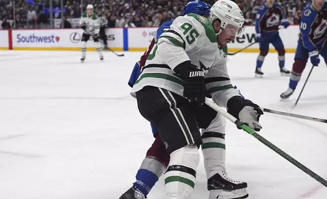 Dallas Stars center Matt Duchene, front, drives past Colorado Avalanche defenseman Sam Malinski in the second period of Game 3 of an NHL hockey first-round playoff series Wednesday, April 23, 2025, in Denver. (AP Photo/David Zalubowski)
