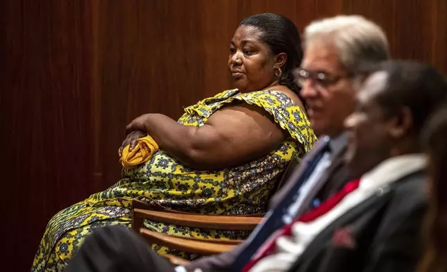 FILE - Patrick Lyoya's mother, Dorcas Lyoya, waits for the Michigan Court of Appeals hearing in the case against Christopher Schurr to begin in downtown Grand Rapids, Mich., on Wednesday, Sept. 6, 2023. (Cory Morse/MLive.com/The Grand Rapids Press via AP)