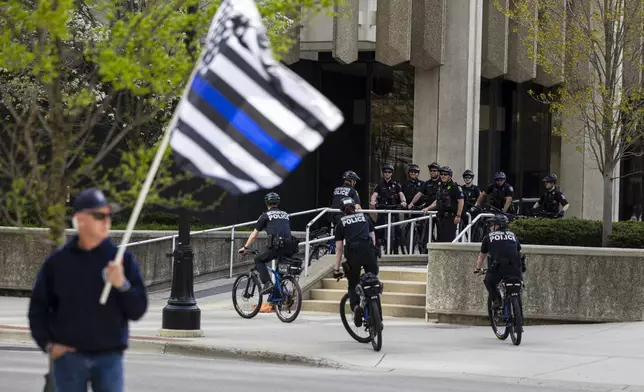 Michigan State Police bicycle unit joins Grand Rapids Police outside the Kent County Courthouse where the first day of trial began for former Grand Rapids Police officer Christopher Schurr, who is charged in the 2022 killing of a Black motorist, Patrick Lyoya, in Grand Rapids, Mich., Monday, April 28, 2025. (Joel Bissell/MLive.com/Kalamazoo Gazette via AP)