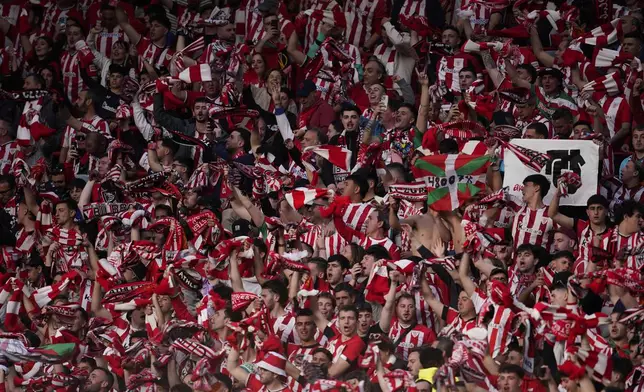 Bilbao fans cheer their team during the Europa League semifinal second leg soccer match between Manchester United and Athletic Bilbao in Manchester, Britain, Thursday, May 8, 2025. (AP Photo/Dave Thompson)