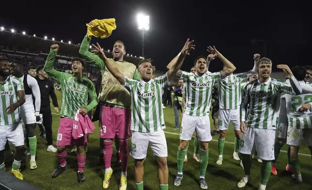 Betis players celebrate following the UEFA Conference League second leg semifinal soccer match between Fiorentina and Real Betis at Artemio Franchi stadium in Florence, Italy, Thursday, May 8, 2025. (Marco Bucco/LaPresse via AP)