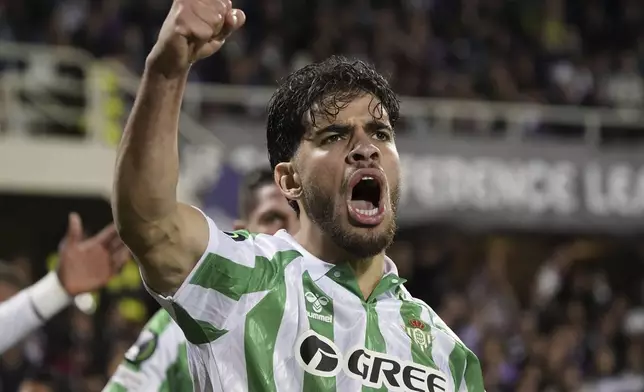 Betis' Abde Ezzalzuoli celebrates after scoring their second goal of the game during the UEFA Conference League second leg semifinal soccer match between Fiorentina and Real Betis at Artemio Franchi stadium in Florence, Italy, Thursday, May 8, 2025. (Marco Bucco/LaPresse via AP)