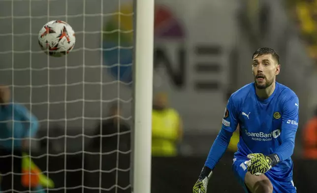 Bodø/Glimt's goalkeeper Nikita Haikin looks back after giving up a goal during the Europa League semifinal soccer match between Bodø/Glimt and Tottenham Hotspur at Aspmyra Stadium, Bodo, Norway, Thursday May 8, 2025. (Stian Lysberg Solum/NTB via AP)