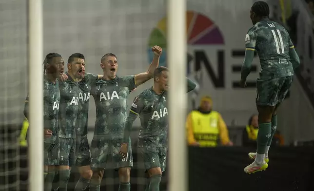 Tottenham's Dominic Solanke, second form left, celebrates with teammates after scoring during the Europa League semifinal soccer match between Bodø/Glimt and Tottenham Hotspur at Aspmyra Stadium, Bodo, Norway, Thursday May 8, 2025. (Stian Lysberg Solum/NTB via AP)