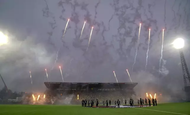 Fireworks before the Europa League semifinal soccer match between Bodø/Glimt and Tottenham Hotspur at Aspmyra Stadium, Bodo, Norway, Thursday May 8, 2025. (Stian Lysberg Solum/NTB via AP)