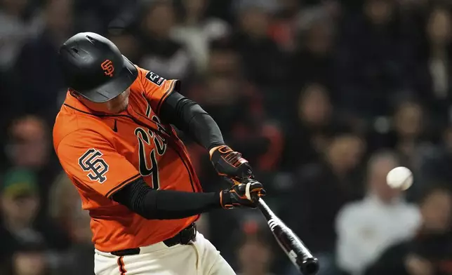 San Francisco Giants' Wilmer Flores hits a three-run home run during the sixth inning of a baseball game against the Athletics, Friday, May 16, 2025, in San Francisco. (AP Photo/Godofredo A. Vásquez)