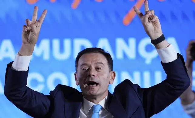 Incumbent Prime Minister and leader of the center-right Social Democratic Party Luis Montenegro gestures while addressing his supporters following Portugal's general election, in Lisbon, Monday, May 19, 2025. (AP Photo/Armando Franca)