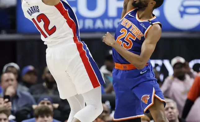 Detroit Pistons forward Tobias Harris (12) takes a jump shot against New York Knicks forward Mikal Bridges (25) during the first half of Game 6 of an NBA basketball first-round playoff series Thursday, May 1, 2025, in Detroit. (AP Photo/Duane Burleson)