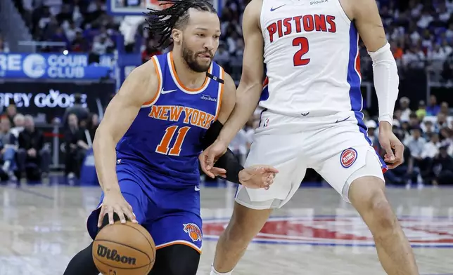 New York Knicks guard Jalen Brunson (11) drives to the basket against Detroit Pistons guard Cade Cunningham (2) during the first half of Game 6 of an NBA basketball first-round playoff series Thursday, May 1, 2025, in Detroit. (AP Photo/Duane Burleson)