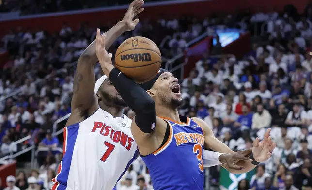 New York Knicks guard Josh Hart (3) loses the ball while defended by Detroit Pistons forward Paul Reed (7) during the first half of Game 6 of an NBA basketball first-round playoff series Thursday, May 1, 2025, in Detroit. (AP Photo/Duane Burleson)