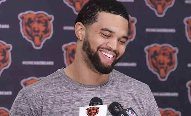 Chicago Bears quarterback Caleb Williams talks to media at a news conference after NFL football practice in Lake Forest, Ill., Wednesday, May 28, 2025. (AP Photo/Nam Y. Huh)