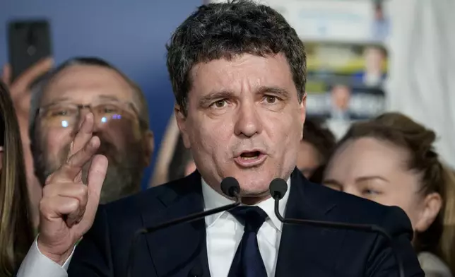 Presidential candidate Nicusor Dan speaks after polls closed for the second round of the country's presidential election redo in Bucharest, Romania, Sunday, May 18, 2025. (AP Photo/Andreea Alexandru)