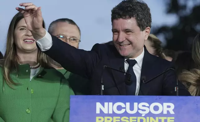 Presidential candidate Nicusor Dan speaks to media after polls closed for the second round of the country's presidential election redo in Bucharest, Romania, Sunday, May 18, 2025. (AP Photo/Andreea Alexandru)