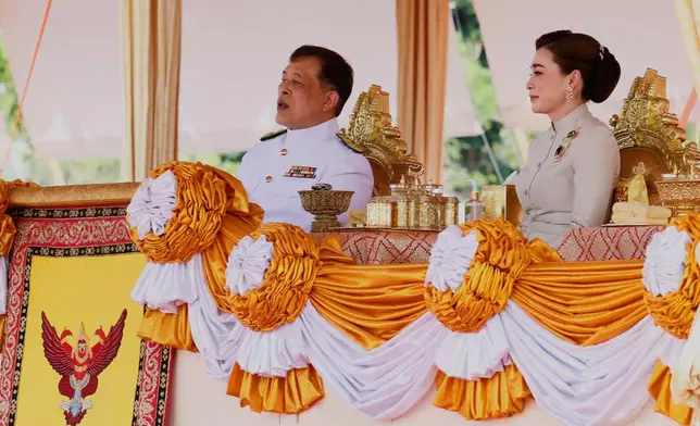 Thailand's King Maha Vajiralongkorn with Queen Suthida, addresses the audience at a royal plowing ceremony in Bangkok, Thailand, Friday, May 9, 2025. (Sunti Teapia/Pool Photo via AP)