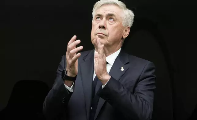 Real Madrid's head coach Carlo Ancelotti applauds prior to a Spanish La Liga soccer match against Real Sociedad at Santiago Bernabeu stadium in Madrid, Saturday, May 24, 2025. (AP Photo/Cesar Cebolla)