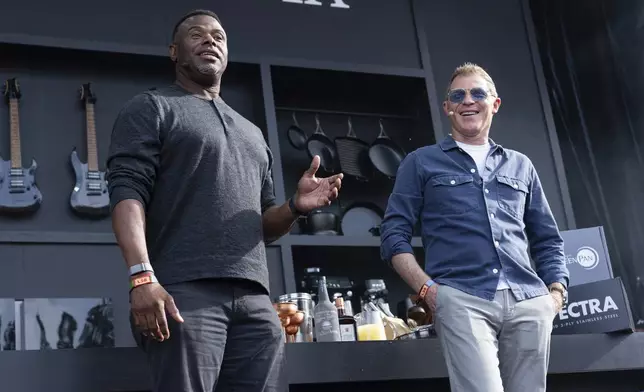 Ken Griffey Jr., left, and Bobby Flay are seen on the Williams Sonoma Culinary Stage at the 2025 BottleRock Napa Valley on Sunday, May 25, 2025, at Napa Valley Expo in Napa, Calif. (Photo by Amy Harris/Invision/AP)