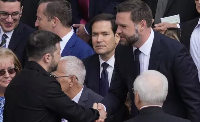 Ukraine's President Volodymr Zelenskyy, left, and Vice President JD Vance greet each other as Secretary of State Marco Rubio, center, looks on ahead of Pope Leo XIV's formal inauguration of his pontificate with a Mass in St. Peter's Square attended by heads of state, royalty and ordinary faithful, Sunday, May 18, 2025. (AP Photo/Gregorio Borgia)