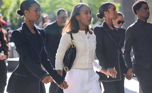 Family and supporters of Sean "Diddy" Combs arrive to the courthouse in New York, Monday, May 12, 2025. (AP Photo/Seth Wenig)