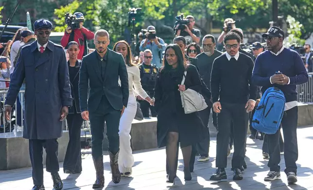 Family and supporters of Sean "Diddy" Combs, including his sons Quincy Brown, third from left, and Justin Combs, second from right, arrive to the courthouse in New York, Monday, May 12, 2025. (AP Photo/Seth Wenig)