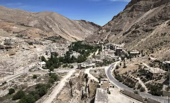 Aerial view of the nearly dry Ein el-Fijeh spring in the Barada Valley, Syria, Thursday, May 8, 2025. As the main water source for Damascus, its depletion has forced many residents in the capital and surrounding suburbs to rely on water from tanker trucks that draw from local wells.(AP Photo/Ghaith Alsayed)