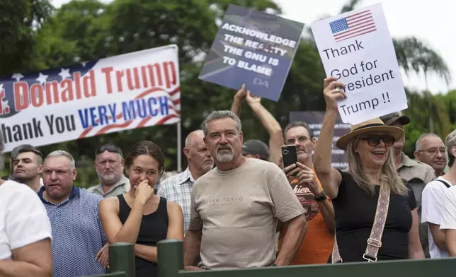 FILE - White South Africans demonstrate in support of U.S. President Donald Trump in front of the U.S. embassy in Pretoria, South Africa, Feb. 15, 2025. (AP Photo/Jerome Delay, File)