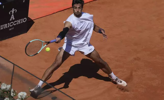 Italy's Lorenzo Musetti returns the ball to United States' Brandon Nakashima, at the Italian Open tennis tournament, in Rome, Sunday, May 11, 2025 (Alfredo Falcone/LaPresse via AP)