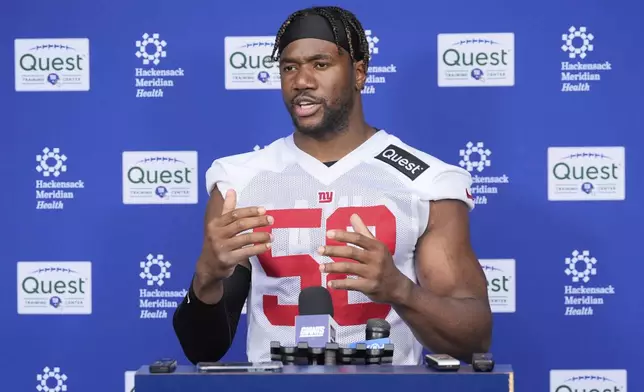 New York Giants' Bobby Okereke talks to reporters after an NFL football practice in East Rutherford, N.J., Wednesday, May 28, 2025. (AP Photo/Seth Wenig)