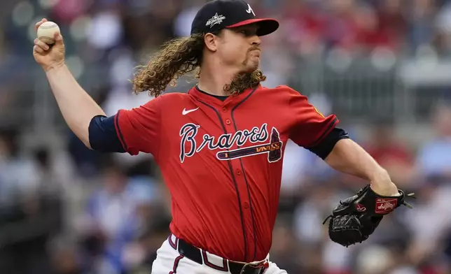 Atlanta Braves pitcher Grant Holmes (66) delivers against the Los Angeles Dodgers in the first inning of a baseball game, Friday, May 2, 2025, in Atlanta. (AP Photo/Mike Stewart)