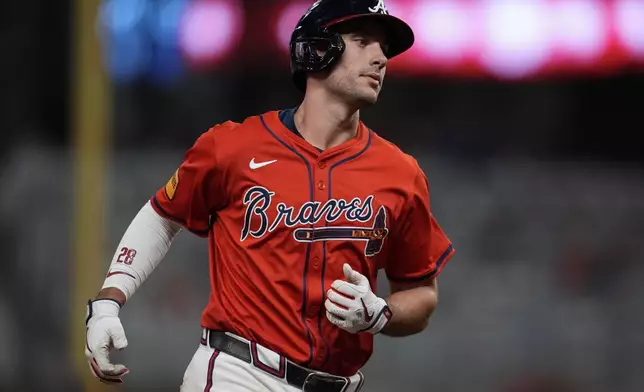 Atlanta Braves first baseman Matt Olson (28) rounds the bases after hitting a solo homer against the Los Angeles Dodgers in the seventh inning of a baseball game, Friday, May 2, 2025, in Atlanta. (AP Photo/Mike Stewart)