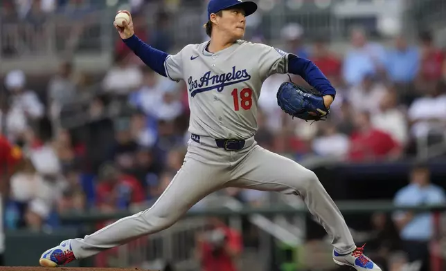Los Angeles Dodgers pitcher Yoshinobu Yamamoto (18) works against the Atlanta Braves in the first inning of a baseball game, Friday, May 2, 2025, in Atlanta. (AP Photo/Mike Stewart)