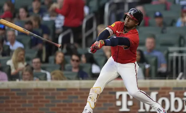 Atlanta Braves second baseman Ozzie Albies (1) loses the bat after stiking out in the second inning of a baseball gamem against the Los Angeles Dodgers, Friday, May 2, 2025, in Atlanta. (AP Photo/Mike Stewart)