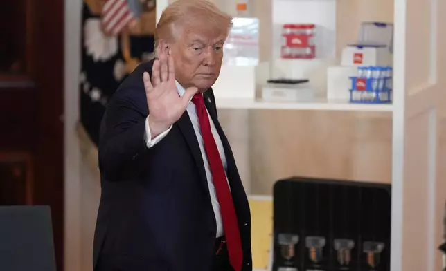 President Donald Trump waves after speaking about investing in America in the Cross Hall of the White House, Wednesday, April 30, 2025, in Washington. (AP Photo/Alex Brandon)