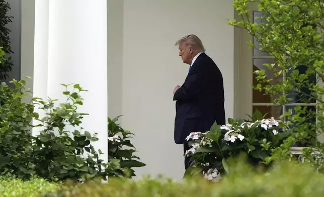 President Donald Trump walks from the Oval Office to depart on Marine One from the South Lawn of the White House, Thursday, May 1, 2025, in Washington. (AP Photo/Alex Brandon)