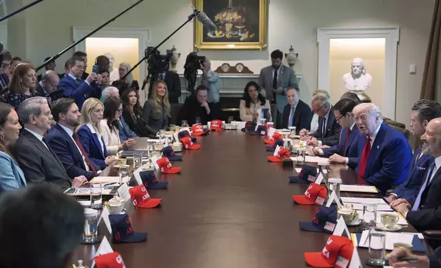 President Donald Trump, right, speaks during a cabinet meeting at the White House, Wednesday, April 30, 2025, in Washington. (AP Photo/Evan Vucci)