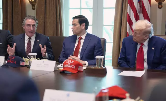 Interior Secretary Doug Burgum speaks during a cabinet meeting at the White House, Wednesday, April 30, 2025, in Washington, as Secretary of State Marco Rubio and President Donald Trump look on. (AP Photo/Evan Vucci)