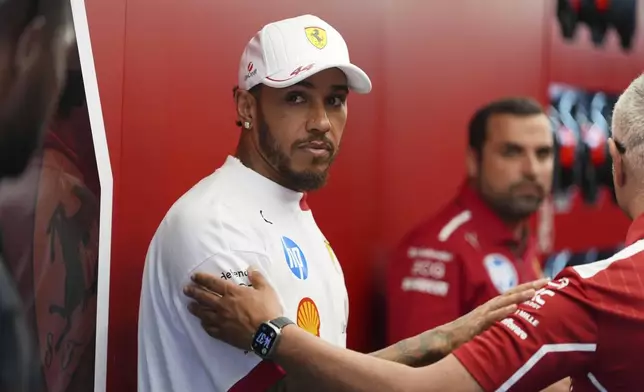 Ferrari driver Lewis Hamilton of Britain prepares to compete before the Formula One Miami Grand Prix auto race Sunday, May 4, 2025, in Miami Gardens. Fla. (AP Photo/Rebecca Blackwell)