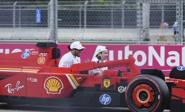 Ferrari Drivers Charles Leclerc and Lewis Hamilton drive together before the Formula One Miami Grand Prix auto race Sunday, May 4, 2025, in Miami Gardens. Fla. (AP Photo/Marta Lavandier)