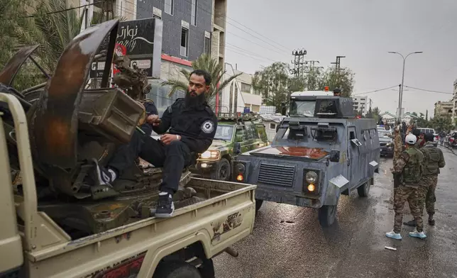 Members of Syria's security forces deploy in the town of Sahnaya, south of Damascus, on Wednesday, April 30, 2025, after earlier clashes with Druze fighters left at least 11 people dead. (AP Photo/Omar Albam)