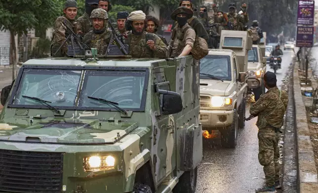 Members of Syria's security forces deploy in the town of Sahnaya, south of Damascus, on Wednesday, April 30, 2025, after earlier clashes with Druze fighters left at least 11 people dead. (AP Photo/Omar Albam)