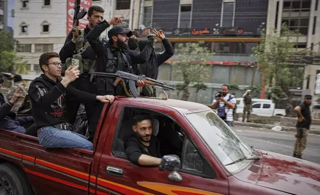 Members of Syria's security forces deploy in the town of Sahnaya, south of Damascus, on Wednesday, April 30, 2025, after earlier clashes with Druze fighters left at least 11 people dead. (AP Photo/Omar Albam)