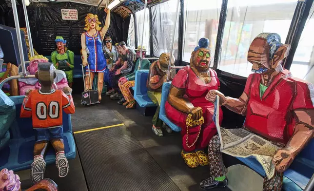 Interior view of The Bus by Red Grooms during a press preview at the Fenix Migration Museum in Rotterdam, Netherlands, Wednesday, May 14, 2025. (AP Photo/Peter Dejong)