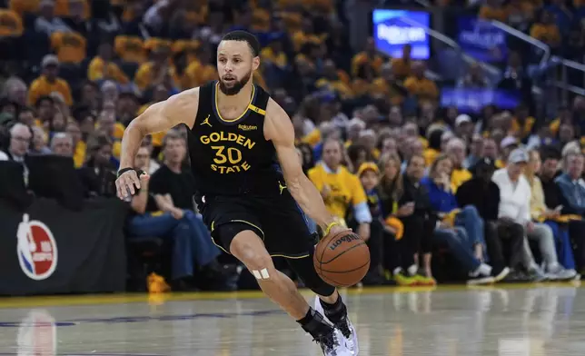 Golden State Warriors guard Stephen Curry moves the ball during the first half of Game 6 of an NBA basketball first-round playoff series against the Houston Rockets, Friday, May 2, 2025, in San Francisco. (AP Photo/Godofredo A. Vásquez)