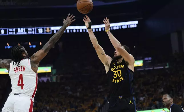 Golden State Warriors guard Stephen Curry (30) shoots a 3-point basket over Houston Rockets guard Jalen Green (4) during the first half of Game 6 of an NBA basketball first-round playoff series Friday, May 2, 2025, in San Francisco. (AP Photo/Godofredo A. Vásquez)
