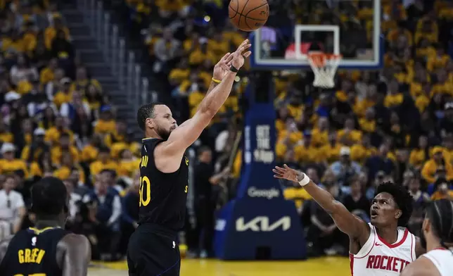 Golden State Warriors guard Stephen Curry (30) shoots a 3-point basket over Houston Rockets forward Amen Thompson (1) during the first half of Game 6 of an NBA basketball first-round playoff series Friday, May 2, 2025, in San Francisco. (AP Photo/Godofredo A. Vásquez)