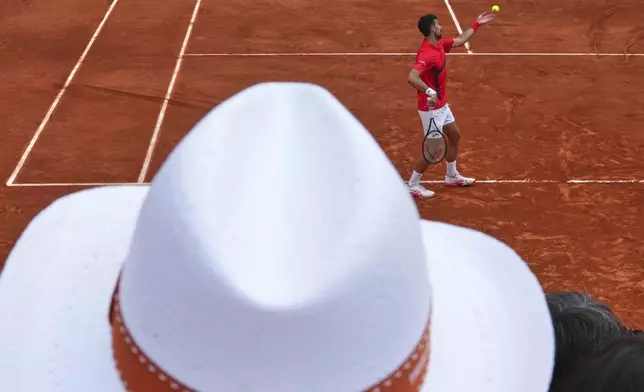 Serbia's Novak Djokovic serves against France's Corentin Moutet during their second round match of the French Tennis Open, at the Roland-Garros stadium, in Paris, Thursday, May 29, 2025. (AP Photo/Lindsey Wasson)