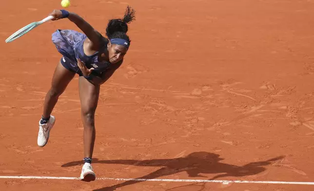 Coco Gauff of the U.S. serves the ball to Tereza Valentova of the Czech Republic during their second round match of the French Tennis Open, at the Roland-Garros stadium, in Paris, Thursday, May 29, 2025. (AP Photo/Christophe Ena)